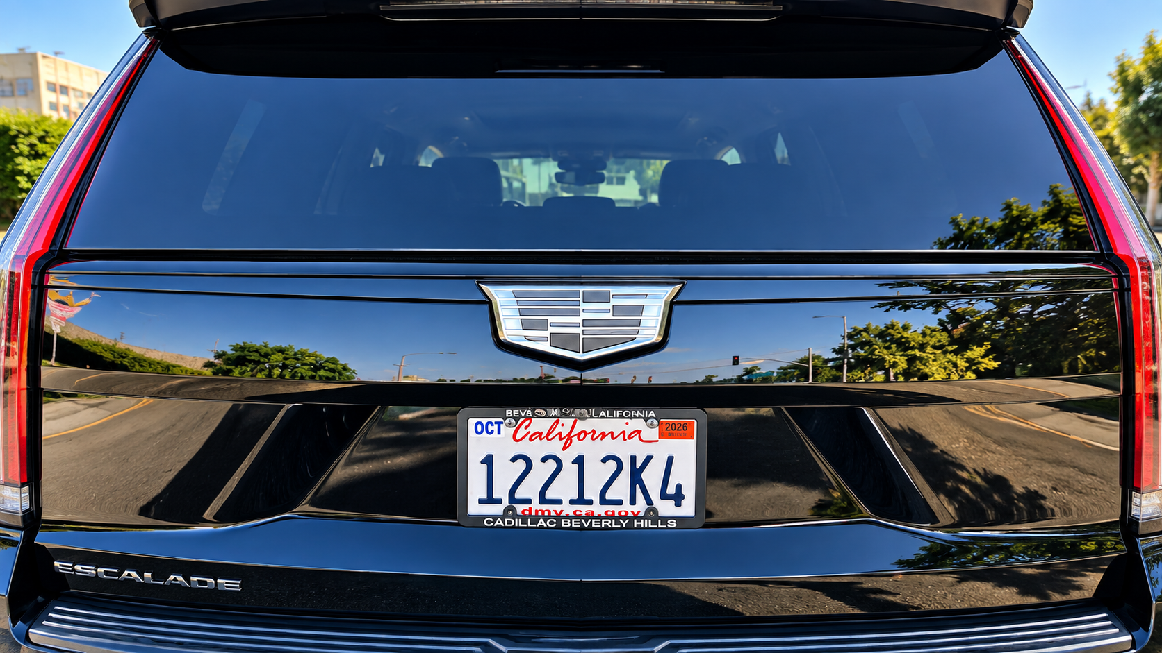 California commercial license plate 12212K4 on a black luxury SUV — a commercial plate is mostly numbers with a single letter